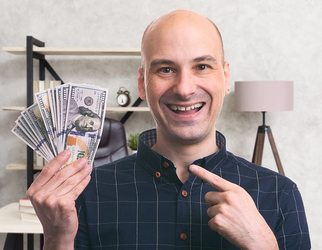 Happy man with money